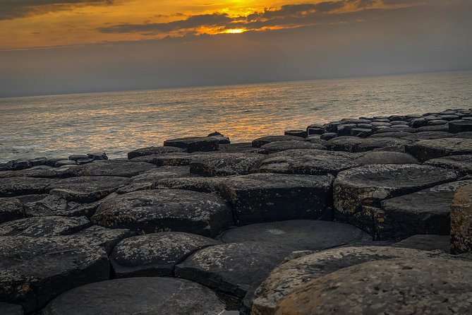 Giants Causeway & Game of Thrones Tour from Belfast - Dunluce Castle above the North Coast